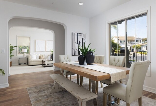 26 Via Fontibre, San Clemente, CA 92673 - dining area featuring arched walkways, light wood-style flooring, baseboards, and recessed lighting