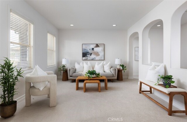 26 Via Fontibre, San Clemente, CA 92673 - living room featuring arched walkways, light carpet, recessed lighting, and baseboards