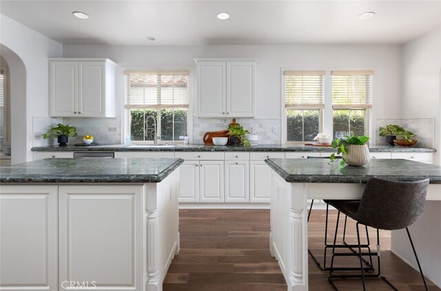 26 Via Fontibre, San Clemente, CA 92673 - kitchen with a sink, a kitchen island, arched walkways, backsplash, and recessed lighting