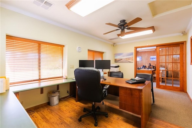 office area with visible vents, wood finished floors, a ceiling fan, and crown molding