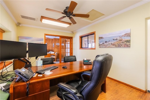 office space featuring ornamental molding, a ceiling fan, visible vents, and wood finished floors