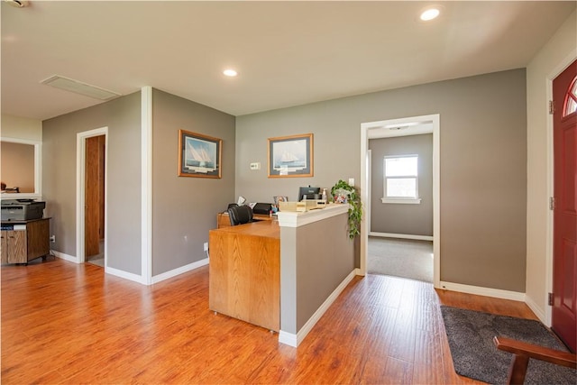 home office with recessed lighting, baseboards, and light wood-style floors
