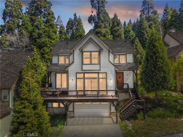 455 Clearwater Ln, Lake Arrowhead, CA 92352 - view of front of home featuring an attached garage, concrete driveway, stairway, and a shingled roof