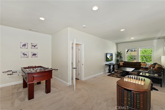 rec room with baseboards, visible vents, light carpet, and recessed lighting