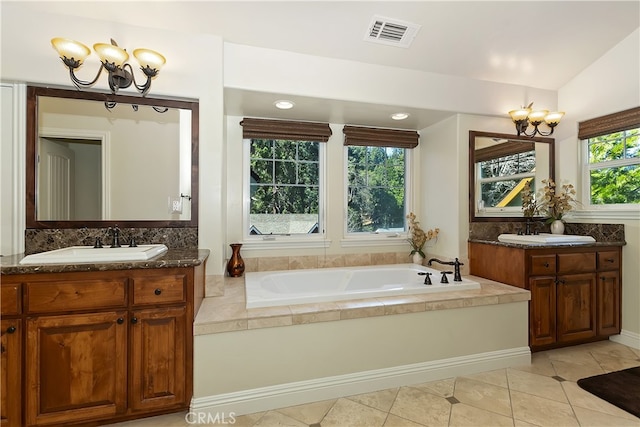 full bathroom featuring a sink, tile patterned flooring, an inviting chandelier, and visible vents