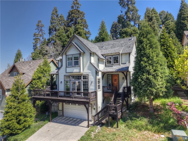 455 Clearwater Ln, Lake Arrowhead, CA 92352 - view of front of house with stairway, a garage, driveway, roof with shingles, and covered porch