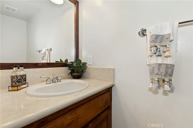 bathroom featuring visible vents and vanity