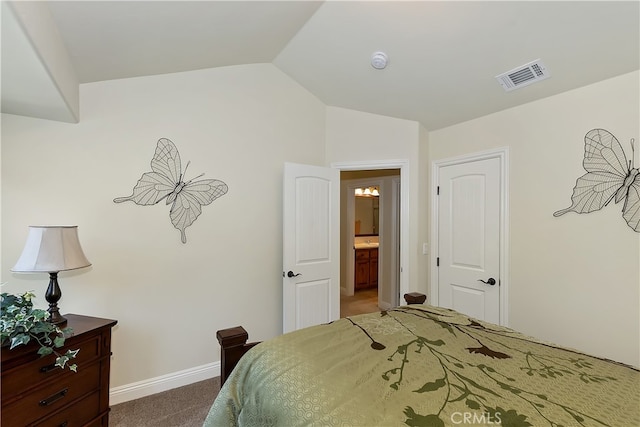 bedroom featuring lofted ceiling, visible vents, dark colored carpet, and baseboards