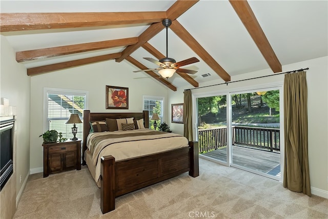 bedroom with lofted ceiling with beams, baseboards, access to exterior, and light carpet