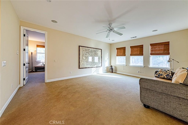 sitting room featuring visible vents, carpet flooring, ceiling fan, and baseboards