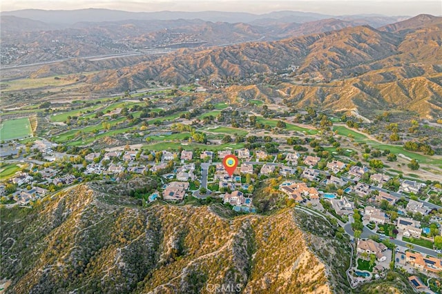 birds eye view of property featuring a mountain view