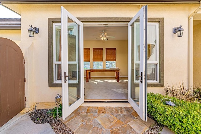doorway to property featuring stucco siding