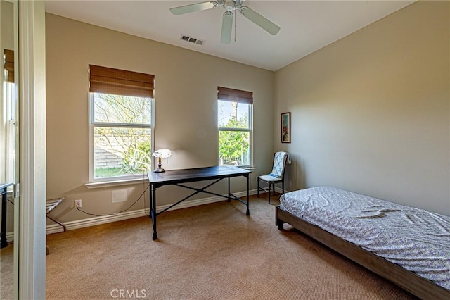 bedroom featuring visible vents, baseboards, a ceiling fan, and carpet floors