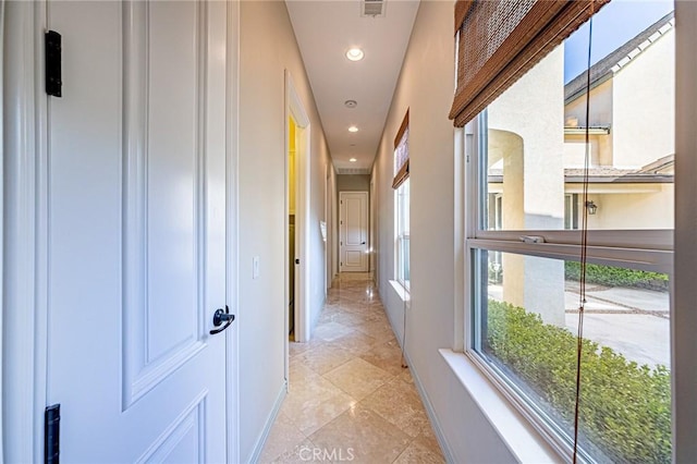 hall with recessed lighting, light tile patterned flooring, visible vents, and baseboards