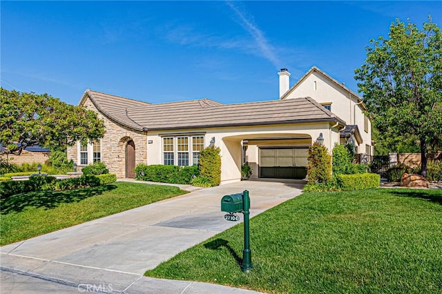 single story home featuring stucco siding, a garage, driveway, stone siding, and a front yard
