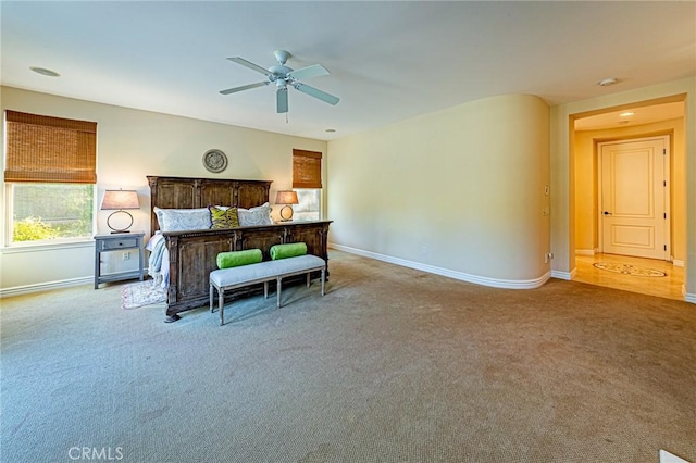 bedroom with carpet flooring, ceiling fan, and baseboards