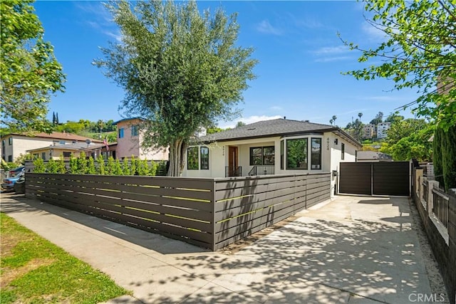 4926 Templeton St, Los Angeles, CA 90032 - single story home with stucco siding, a gate, and a fenced front yard