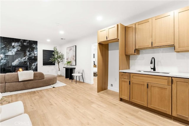 4926 Templeton St, Los Angeles, CA 90032 - kitchen featuring recessed lighting, light countertops, a sink, light wood-type flooring, and open floor plan