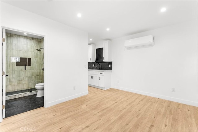 4926 Templeton St, Los Angeles, CA 90032 - unfurnished living room with recessed lighting, an AC wall unit, and baseboards