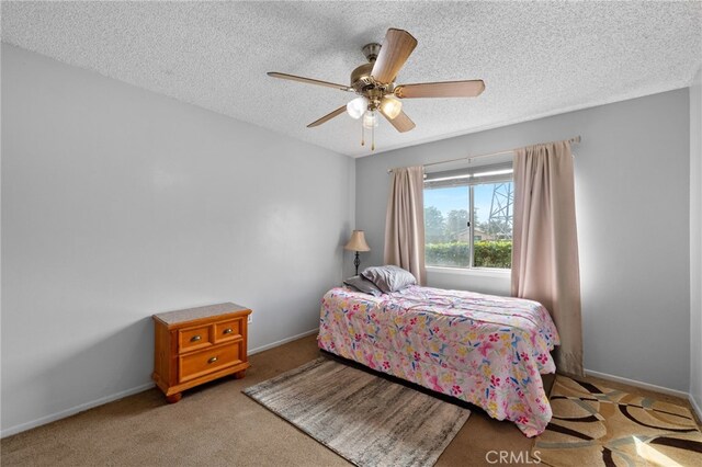3406 Elm St, Bakersfield, CA 93301 - bedroom with a textured ceiling, carpet flooring, ceiling fan, and baseboards