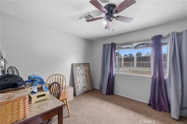 3406 Elm St, Bakersfield, CA 93301 - home office with carpet, baseboards, visible vents, a ceiling fan, and a textured ceiling