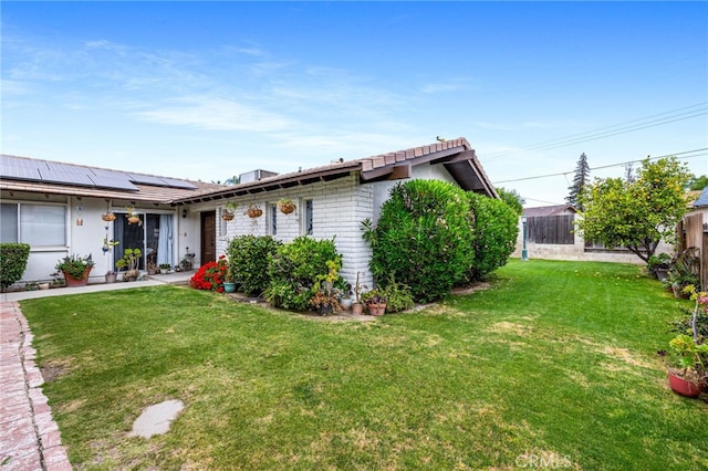 3406 Elm St, Bakersfield, CA 93301 - ranch-style home featuring a front yard, solar panels, and fence