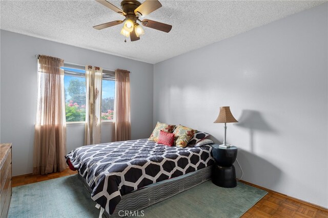3406 Elm St, Bakersfield, CA 93301 - bedroom featuring a textured ceiling and a ceiling fan