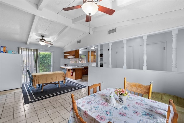 3406 Elm St, Bakersfield, CA 93301 - dining area featuring light tile patterned floors, a ceiling fan, visible vents, and lofted ceiling with beams