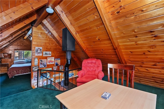 carpeted bedroom featuring wooden walls, vaulted ceiling with beams, and wood ceiling