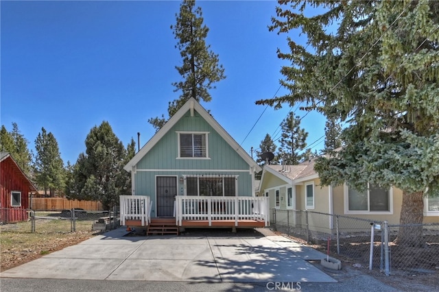 view of front of home with fence private yard and a wooden deck
