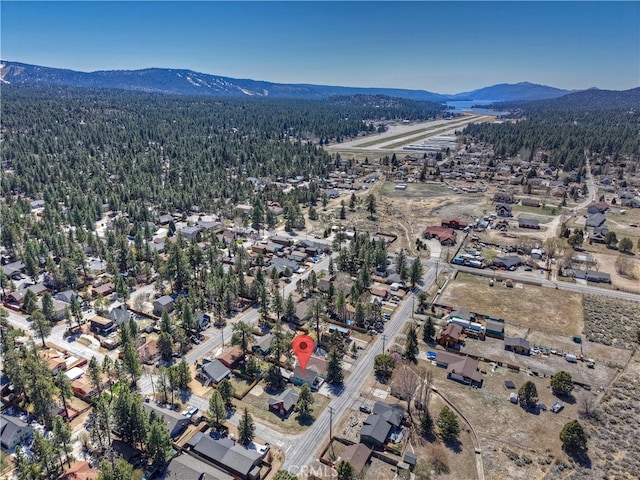 aerial view with a mountain view and a view of trees
