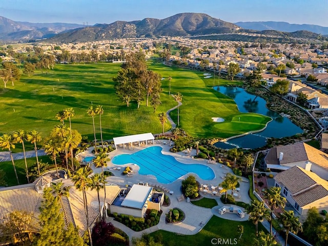 aerial view featuring a water and mountain view, a residential view, and golf course view