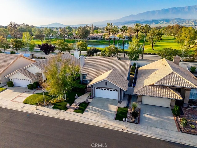 birds eye view of property with a residential view and a water and mountain view