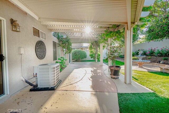 view of patio with a pergola, fence, and central AC unit