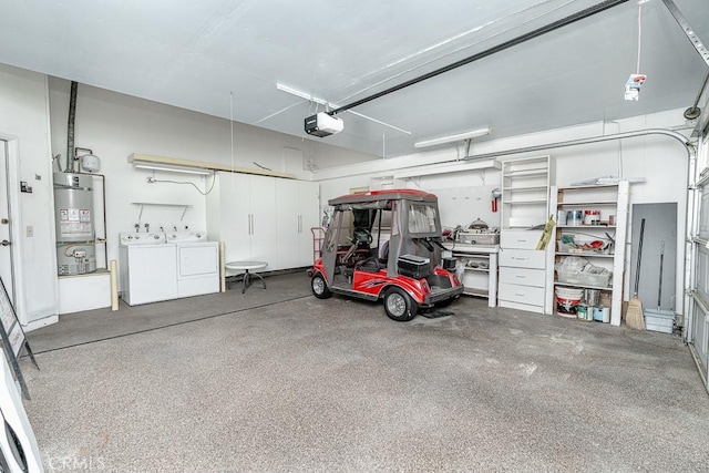 garage featuring a garage door opener, water heater, and separate washer and dryer