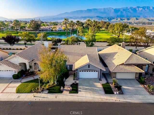 birds eye view of property with a water and mountain view and a residential view