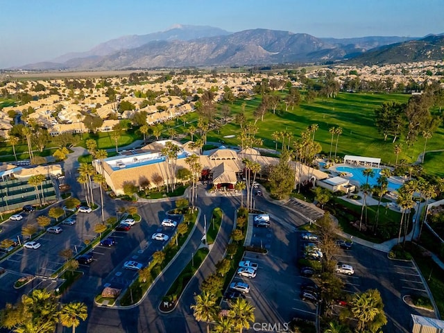 birds eye view of property with a mountain view, golf course view, and a residential view