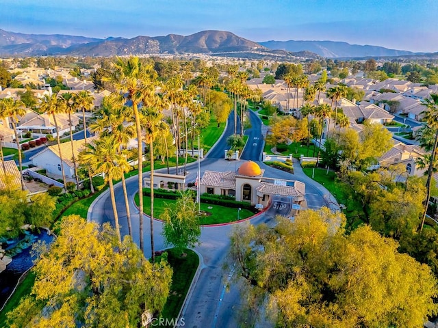 birds eye view of property with a mountain view and a residential view