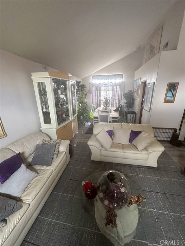 living area featuring vaulted ceiling