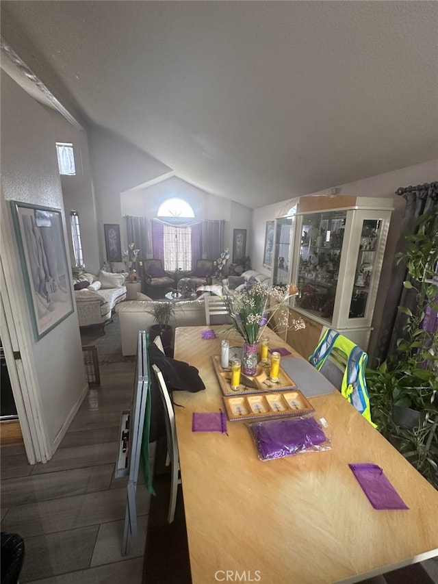 dining room with vaulted ceiling