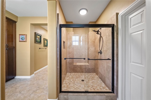 33931 Baystone St, Temecula, CA 92592 - bathroom featuring a shower stall, tile patterned flooring, and baseboards