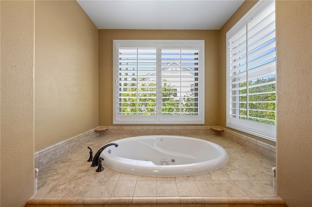 33931 Baystone St, Temecula, CA 92592 - full bathroom with healthy amount of natural light, a tub with jets, and a textured wall