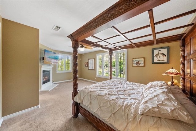 33931 Baystone St, Temecula, CA 92592 - bedroom featuring light carpet, a glass covered fireplace, baseboards, and a ceiling fan