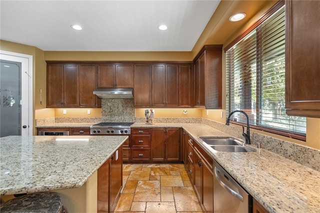 33931 Baystone St, Temecula, CA 92592 - kitchen featuring stainless steel appliances, a sink, under cabinet range hood, stone tile flooring, and recessed lighting