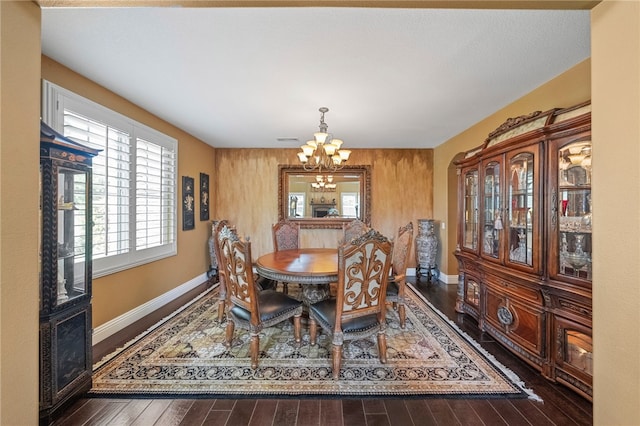 33931 Baystone St, Temecula, CA 92592 - dining space featuring a chandelier, wood finished floors, and baseboards