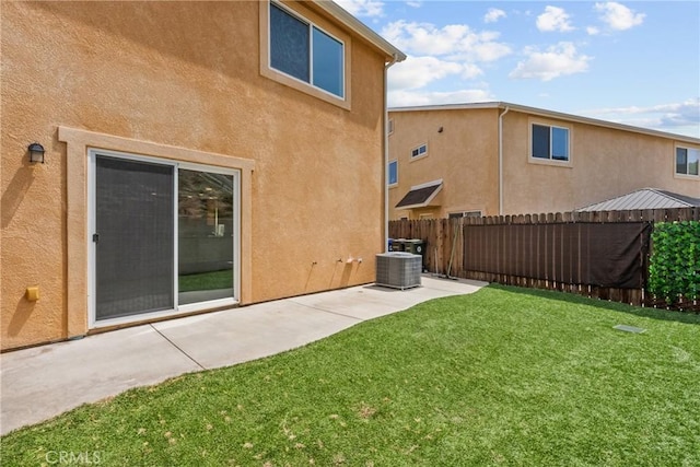 26145 Gravett Pl, Saugus, CA 91350 - back of property featuring a patio area, a yard, stucco siding, and fence