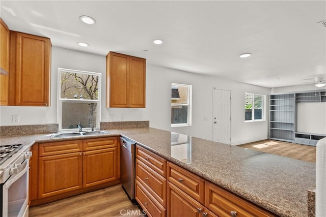 26145 Gravett Pl, Saugus, CA 91350 - kitchen featuring light wood-type flooring, dishwasher, gas stove, and a sink
