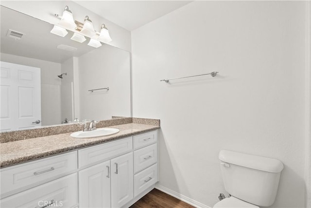 26145 Gravett Pl, Saugus, CA 91350 - bathroom with vanity, toilet, visible vents, a shower, and baseboards