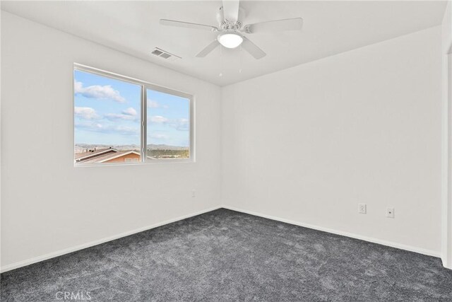 26145 Gravett Pl, Saugus, CA 91350 - unfurnished room with dark colored carpet, visible vents, ceiling fan, and baseboards