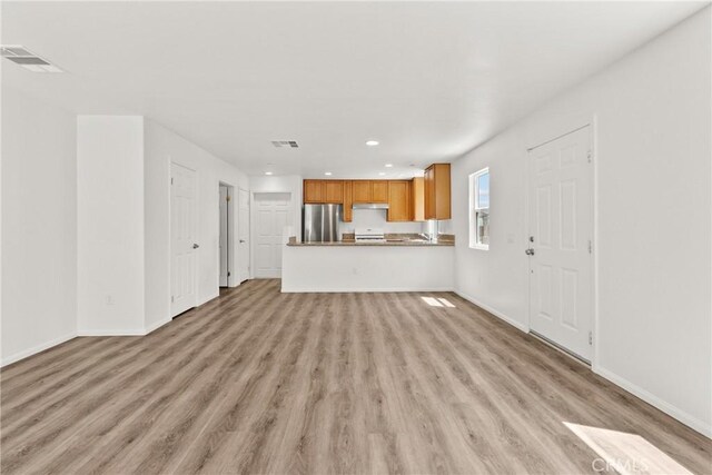 26145 Gravett Pl, Saugus, CA 91350 - unfurnished living room featuring light wood finished floors, recessed lighting, visible vents, and baseboards